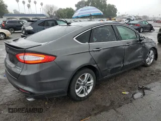 2016 Ford Fusion Titanium Hybrid z VIN 3FA6P0RU5GR356987, wystawiony jako Copart lot #48211775 z przebiegiem 145 192 mil mil oraz Szkoda całkowita • Salvage title. Historia ofert i sprzedaży dostępna na DreamBid. Obrazek 3.