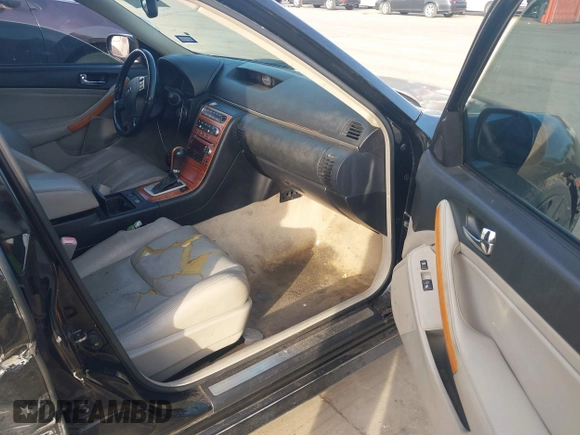 2005 Infiniti G35 with VIN JNKCV51E15M205962, listed as a IAAI auction lot 41386642 with 194,197 mi miles and . Bid and sale history available at DreamBid. Image 5.