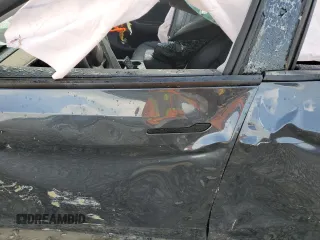 2024 Tesla Model Y Long Range z VIN 7SAYGDEEXRA324517, wystawiony jako Copart lot #55274615 z przebiegiem Nie podano mil oraz Szkoda całkowita • Salvage title. Historia ofert i sprzedaży dostępna na DreamBid. Obrazek 7.