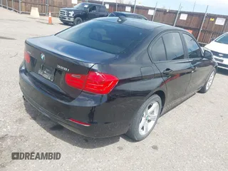 2014 BMW 3 Series 328i xDrive with VIN WBA3B3C56EJ981322, listed as a IAAI auction lot 42104530 with 104,376 mi miles. Bid and sale history available at carsss.com. Image 4.