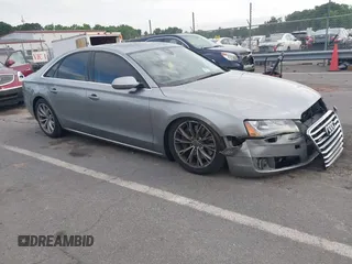 2011 Audi A8 z VIN WAUAVAFD0BN018197, wystawiony jako IAAI lot #42221435 z przebiegiem 74 465 mil mil oraz . Historia ofert i sprzedaży dostępna na DreamBid. Obrazek 1.