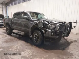 2019 Toyota Tacoma SR with VIN 5TFCZ5AN7KX208672, listed as a IAAI auction lot 42143071 with 83,584 mi miles and . Bid and sale history available at DreamBid. Image 1.