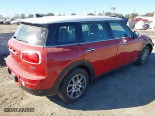 2016 MINI Cooper Clubman with VIN WMWLN5C51G2E30234, listed as a IAAI auction lot 41408299 with 81,895 mi miles. Bid and sale history available at carsss.com. Image 4.