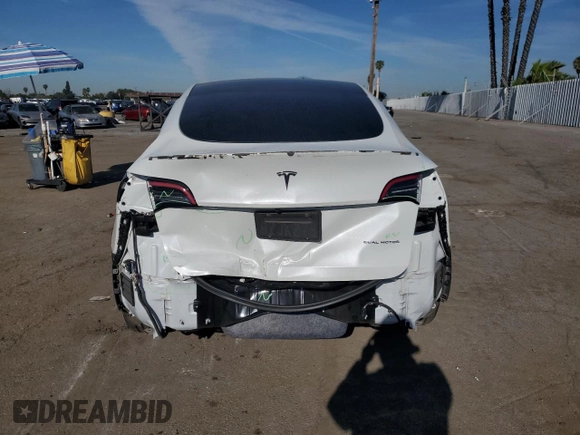 2022 Tesla Model Y Long Range with VIN 7SAYGDEE1NF339663, listed as a Copart auction lot 49771965 with 33,734 mi miles and Salvage Title. Bid and sale history available at carsss.com. Image 6.