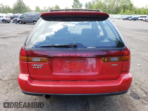 1998 Subaru Legacy GT with VIN 4S3BK6750W7320376, listed as a Copart auction lot 58223125 with 127,481 mi miles and Salvage title. Bid and sale history available at DreamBid. Image 6.