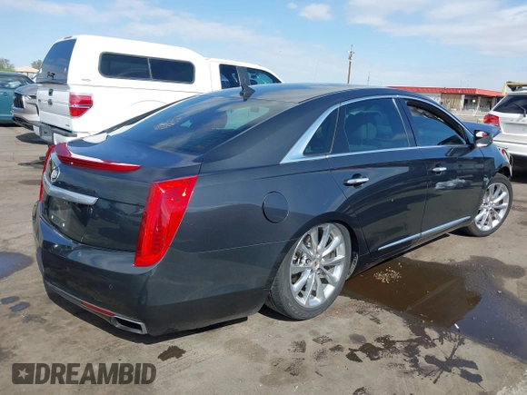 2013 Cadillac XTS Luxury with VIN 2G61P5S31D9182553, listed as a IAAI auction lot 42076227 with 116,849 mi miles and . Bid and sale history available at DreamBid. Image 4.