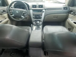 2010 Mercury Milan Premier z VIN 3MEHM0JA6AR646061, wystawiony jako Copart lot #58834665 z przebiegiem 144 523 mil mil oraz Szkoda całkowita • Salvage title. Historia ofert i sprzedaży dostępna na DreamBid. Obrazek 8.