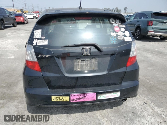 2012 Honda Fit Sport with VIN JHMGE8H5XCC006016, listed as a Copart auction lot 52941995 with 196,312 mi miles and Salvage Title. Bid and sale history available at carsss.com. Image 6.