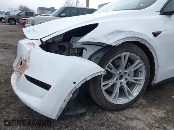 2022 Tesla Model Y Long Range with VIN 7SAYGAEE4NF516625, listed as a IAAI auction lot 41892225 with 33,054 mi miles and . Bid and sale history available at DreamBid. Image 6.