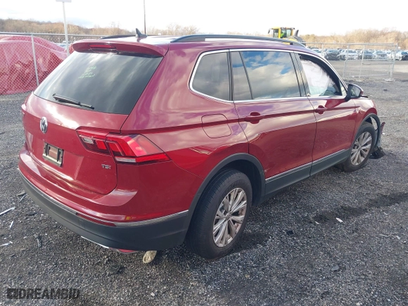 2018 Volkswagen Tiguan SEL with VIN 3VV3B7AX1JM076161, listed as a IAAI auction lot 40931210 with 106,916 mi miles. Bid and sale history available at carsss.com. Image 4.
