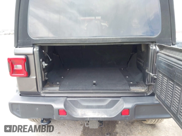 2019 Jeep Wrangler Unlimited Sahara with VIN 1C4HJXEN3KW622167, listed as a IAAI auction lot 41880702 with 72,928 mi miles and . Bid and sale history available at DreamBid. Image 18.
