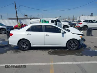 2013 Toyota Corolla L with VIN JTDBU4EE1DJ116557, listed as a IAAI auction lot 41981691 with 169,898 mi miles. Bid and sale history available at carsss.com. Image 14.