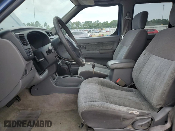 2000 Nissan Frontier XE with VIN 1N6ED27T3YC343320, listed as a Copart auction lot 64883025 with 168,047 mi miles and Clean title. Bid and sale history available at DreamBid. Image 7.