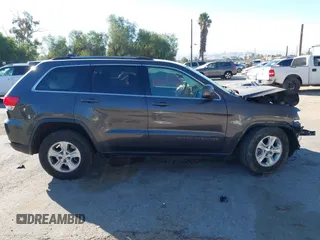 2017 Jeep Grand Cherokee Laredo with VIN 1C4RJEAG8HC944037, listed as a IAAI auction lot 41299619 with 140,405 mi miles. Bid and sale history available at carsss.com. Image 13.