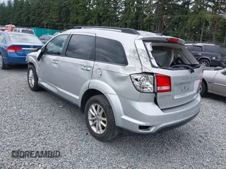 2013 Dodge Journey SXT with VIN 3C4PDDBG1DT507356, listed as a IAAI auction lot 42592501 with 128,094 mi miles and . Bid and sale history available at DreamBid. Image 3.