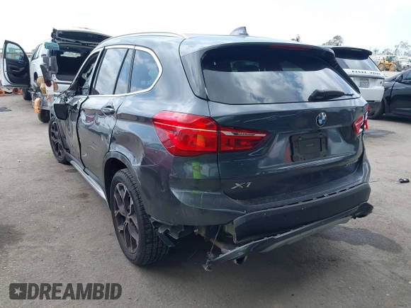 2021 BMW X1 xDrive28i with VIN WBXJG9C03M3M80011, listed as a IAAI auction lot 42137781 with 132,969 mi miles. Bid and sale history available at carsss.com. Image 3.
