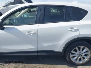 2015 Mazda CX-5 Grand Touring with VIN JM3KE2DY5F0498718, listed as a IAAI auction lot 42070000 with 129,327 mi miles. Bid and sale history available at carsss.com. Image 15.