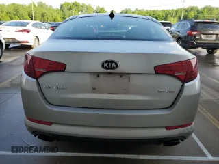 2013 Kia Optima EX z VIN 5XXGN4A72DG165846, wystawiony jako Copart lot #54597195 z przebiegiem 175 218 mil mil oraz Szkoda całkowita • Salvage title. Historia ofert i sprzedaży dostępna na DreamBid. Obrazek 6.