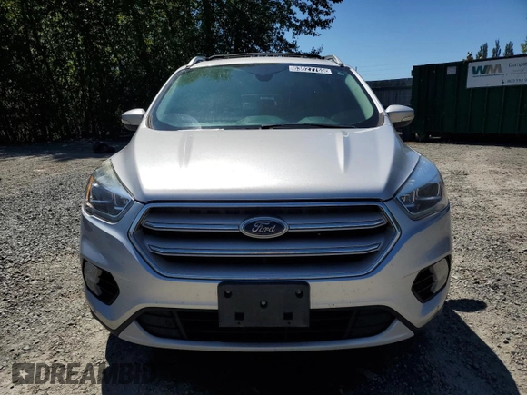 2019 Ford Escape Titanium z VIN 1FMCU0J92KUB62184, wystawiony jako Copart lot #63027765 z przebiegiem 136 005 mil mil oraz Czysty tytuł • Clean title. Historia ofert i sprzedaży dostępna na DreamBid. Obrazek 5.