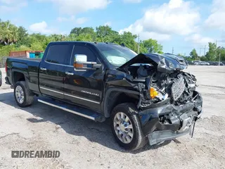 2019 GMC Sierra 2500HD Denali z VIN 1GT12SEY7KF277723, wystawiony jako IAAI lot #41661127 z przebiegiem 142 787 mil mil oraz . Historia ofert i sprzedaży dostępna na DreamBid. Obrazek 1.