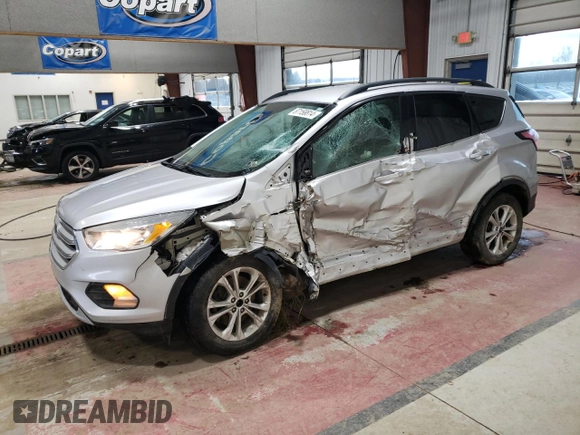 2018 Ford Escape SE with VIN 1FMCU9GD7JUA25403, listed as a Copart auction lot 87158814 with 121,281 mi miles and Salvage Title. Bid and sale history available at carsss.com. Image 1.