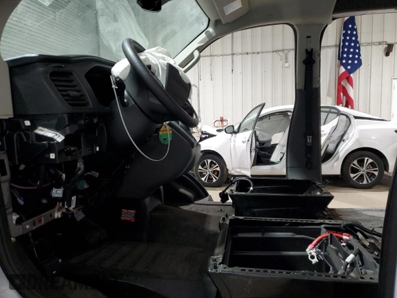 2023 Ford Transit Cargo with VIN 1FTBR1Y81PKB56612, listed as a Copart auction lot 46652685 with Not Provided miles and Salvage Title. Bid and sale history available at DreamBid. Image 7.