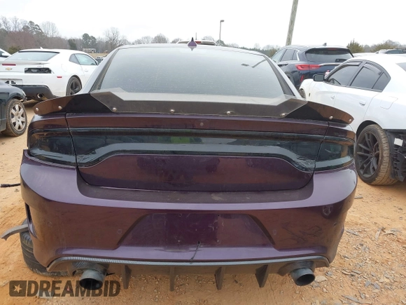 2021 Dodge Charger Scat Pack Widebody with VIN 2C3CDXGJ5MH579324, listed as a IAAI auction lot 41399676 with 77,156 mi miles and . Bid and sale history available at DreamBid. Image 16.