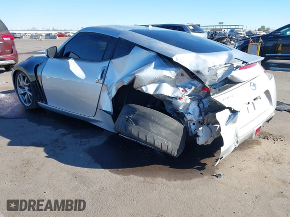 2014 Nissan 370Z Nismo with VIN JN1AZ4EHXEM634418, listed as a IAAI auction lot 41308580 with 84,074 mi miles and . Bid and sale history available at DreamBid. Image 6.
