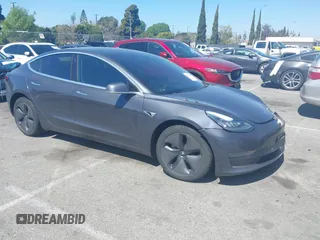 2018 Tesla Model 3 Long Range Battery z VIN 5YJ3E1EA9JF042319, wystawiony jako IAAI lot #41871931 z przebiegiem 138 837 mil mil oraz . Historia ofert i sprzedaży dostępna na DreamBid. Obrazek 1.