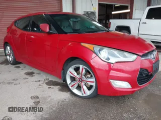 2014 Hyundai Veloster z VIN KMHTC6AD3EU201508, wystawiony jako IAAI lot #42353066 z przebiegiem 140 032 mil mil oraz . Historia ofert i sprzedaży dostępna na DreamBid. Obrazek 1.