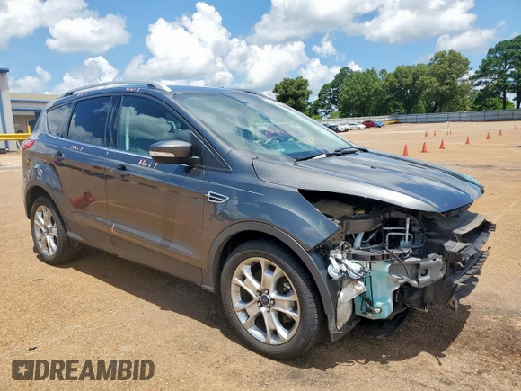 2015 Ford Escape Titanium with VIN 1FMCU0J92FUB80769, listed as a Copart auction lot 61988435 with 103,212 mi miles and Salvage title. Bid and sale history available at DreamBid. Image 4.