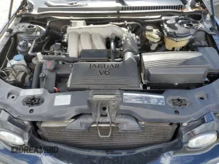 2004 Jaguar X-Type with VIN SAJEA51C74WD56736, listed as a Copart auction lot 48038295 with 115,817 mi miles and Salvage Title. Bid and sale history available at DreamBid. Image 11.