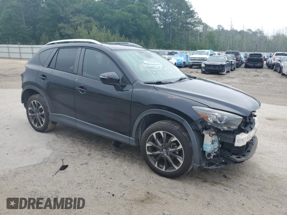 2016 Mazda CX-5 Grand Touring z VIN JM3KE2DY5G0676290, wystawiony jako Copart lot #54155325 z przebiegiem 124 743 mil mil oraz Szkoda całkowita • Salvage title. Historia ofert i sprzedaży dostępna na DreamBid. Obrazek 4.