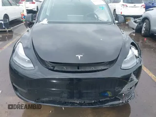 2023 Tesla Model Y Long Range with VIN 7SAYGDEE5PF766685, listed as a IAAI auction lot 41933729 with 25,959 mi miles and . Bid and sale history available at DreamBid. Image 11.