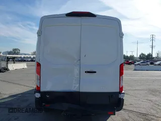2023 Ford Transit Cargo with VIN 1FTBR1C85PKC08945, listed as a IAAI auction lot 41385685 with 5,577 mi miles and . Bid and sale history available at DreamBid. Image 17.