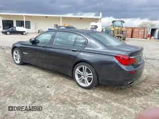 2014 BMW 7 Series 740Li with VIN WBAYE4C56ED138397, listed as a IAAI auction lot 41726117 with 116,291 mi miles. Bid and sale history available at carsss.com. Image 3.