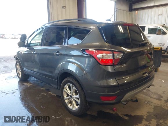 2018 Ford Escape SE with VIN 1FMCU9GD1JUC36452, listed as a IAAI auction lot 41964531 with 89,457 mi miles. Bid and sale history available at carsss.com. Image 3.