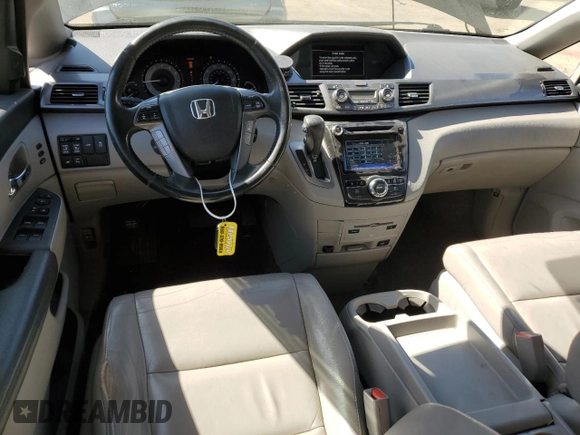 2014 Honda Odyssey Touring with VIN 5FNRL5H99EB088859, listed as a Copart auction lot 54828555 with 147,147 mi miles and Salvage Title. Bid and sale history available at DreamBid. Image 8.