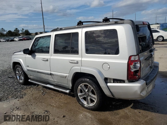 2006 Jeep Commander with VIN 1J8HH48K96C289162, listed as a Copart auction lot 80979074 with 170,581 mi miles and Salvage title. Bid and sale history available at DreamBid. Image 2.
