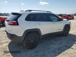 2015 Jeep Cherokee Trailhawk with VIN 1C4PJMBS0FW705288, listed as a Copart auction lot 61796275 with 133,874 mi miles and Salvage title. Bid and sale history available at DreamBid. Image 3.