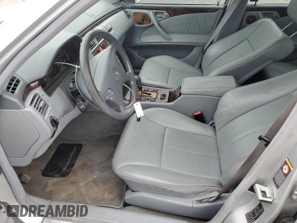 2000 Mercedes-Benz E 320 with VIN WDBJF65J1YB099417, listed as a Copart auction lot 54656915 with 130,387 mi miles and Salvage Title. Bid and sale history available at DreamBid. Image 7.