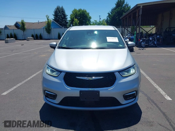 2023 Chrysler Pacifica Hybrid Touring L with VIN 2C4RC1L75PR614460, listed as a IAAI auction lot 42628545 with 68,668 mi miles and . Bid and sale history available at DreamBid. Image 12.