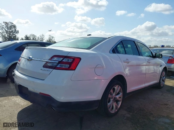 2015 Ford Taurus Limited with VIN 1FAHP2F80FG144421, listed as a IAAI auction lot 41947787 with 143,496 mi miles. Bid and sale history available at carsss.com. Image 4.