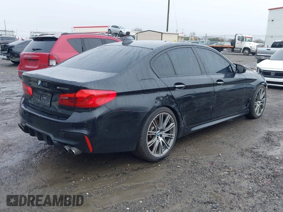2018 BMW 5 Series M550i xDrive with VIN WBAJB9C59JB049114, listed as a IAAI auction lot 41543633 with 87,942 mi miles and . Bid and sale history available at carsss.com. Image 4.