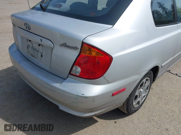 2005 Hyundai Accent GLS with VIN KMHCG35C65U332999, listed as a IAAI auction lot 42097932 with 225,593 mi miles. Bid and sale history available at carsss.com. Image 6.
