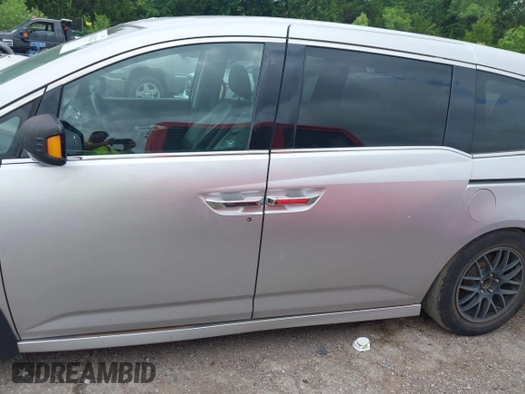 2011 Honda Odyssey Touring with VIN 5FNRL5H93BB071518, listed as a IAAI auction lot 42402421 with 227,647 mi miles and . Bid and sale history available at DreamBid. Image 14.
