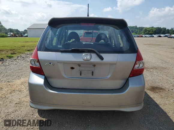 2007 Honda Fit Sport with VIN JHMGD38687S067648, listed as a Copart auction lot 64657345 with 123,055 mi miles and Salvage title. Bid and sale history available at DreamBid. Image 6.