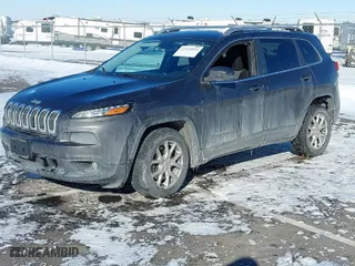2014 Jeep Cherokee Latitude with VIN 1C4PJLCS8EW142983, listed as a IAAI auction lot 41569094 with 1 mi miles. Bid and sale history available at carsss.com. Image 2.