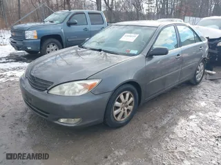 2003 Toyota Camry LE with VIN 4T1BE30K53U649007, listed as a IAAI auction lot 41030219 with 208,469 mi miles. Bid and sale history available at carsss.com. Image 2.