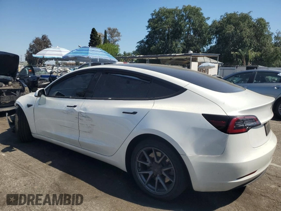 2023 Tesla Model 3 with VIN 5YJ3E1EA8PF394705, listed as a Copart auction lot 52319945 with 58,193 mi miles and Salvage title. Bid and sale history available at DreamBid. Image 2.